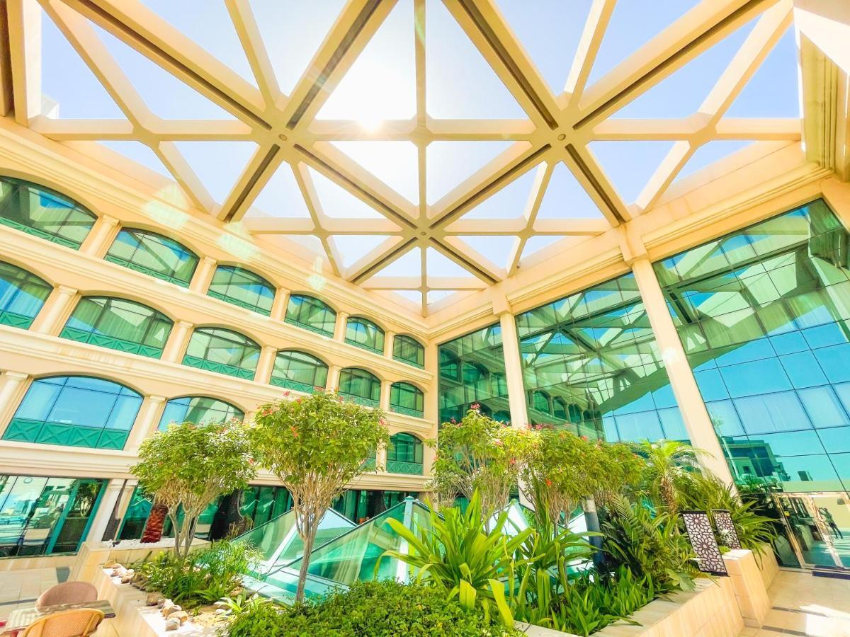 Moevenpick Grand Al Bustan Hotel Dubai Exterior photo The atrium of the hotel