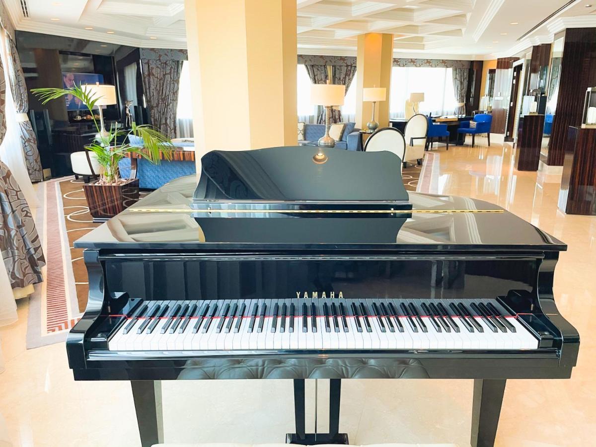 Moevenpick Grand Al Bustan Hotel Dubai Exterior photo A piano in the lobby of the hotel