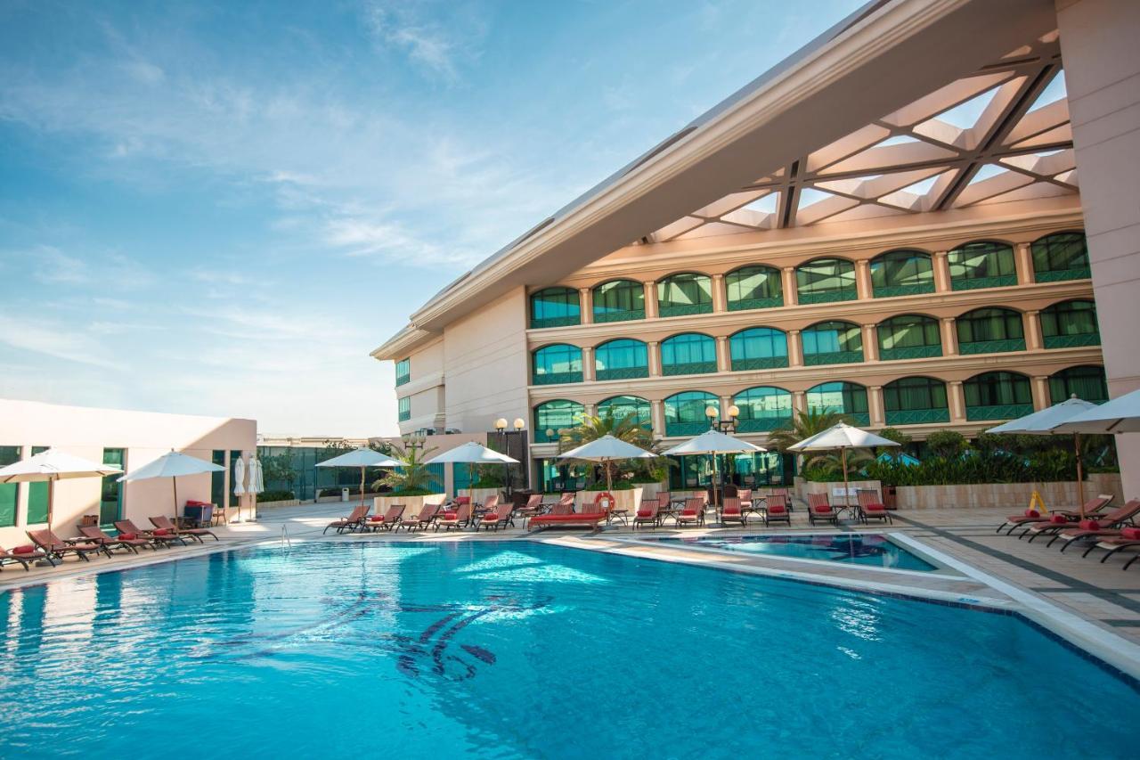 Moevenpick Grand Al Bustan Hotel Dubai Exterior photo The swimming pool at the hotel